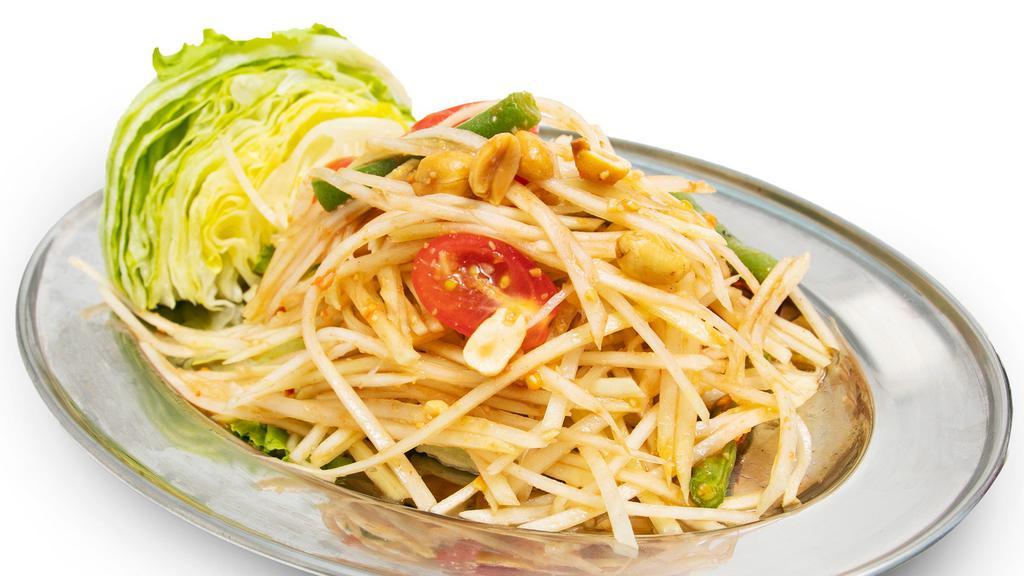 Thai Papaya Salad (Without Fish Sauce) · Green papaya, garlic, string bean, tomato, ground peanut, chili and lettuce with chili-lime dressing. Gluten free and spicy.