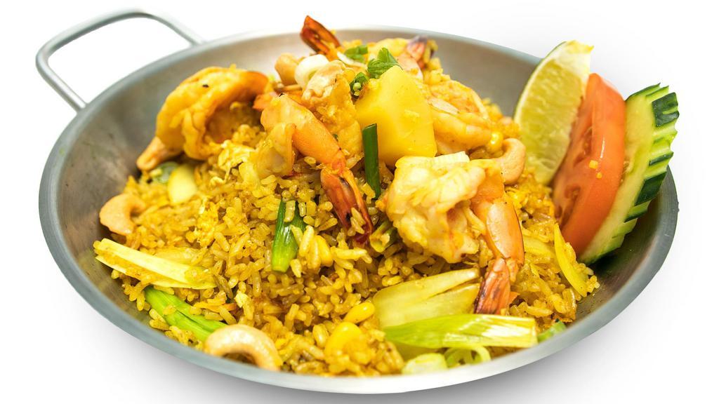 Pineapple Fried Rice · Stir fried rice with Pineapple, egg, onion, cashew nut, corn, snow pea and carrot and curry powder.
