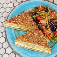 Pesto Mozzarella Sandwich · Pesto, Mozzarella, Avocado, Tomatoes on Toasted 8 grain w Side salad.