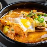 Spicy Seafood Soup · Tofu, egg, assorted seafood and zucchini.