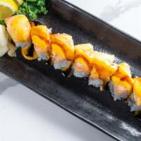 American Dream Roll · Inside rock shrimp tempura and avocado. Topped kani and lobster salad. Sauce spicy mango sau...
