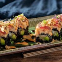 Takumi Roll · Inside lobster tempura, avocado. Topped lobster salad, pepper tuna. Sauce eel and spicy mayo.
