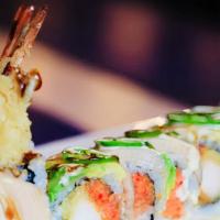 Angry Dragon Roll · Inside shrimp tempura and spicy tuna. Topped yellowtail, avocado, and jalapeño. Sauce yuzu w...