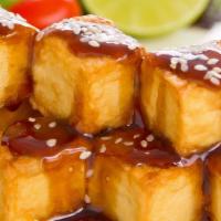 Tofu Teriyaki · Served with white rice miso soup kani salad spring roll california roll and mixed fruits.