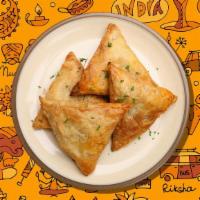 Lamb Samosa Lust · Turnover filled with curried minced meat.Served with mint, onion chutneys and tamarind chutn...