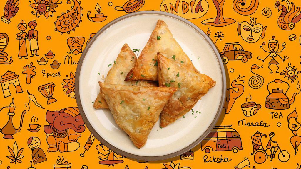 Lamb Samosa Lust · Turnover filled with curried minced meat.Served with mint, onion chutneys and tamarind chutneys