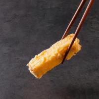 Tamagoyaki  · Crispy tempura fried egg done omelette style with a slightly sweet flavor and custardy texture