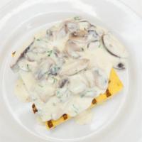 Polenta · Gluten-free. Grilled Italian corn meal with wild mushrooms and melted Fontina cheese.