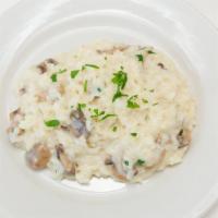 Funghi Risotto · With wild mushrooms and a vegetable stock base.