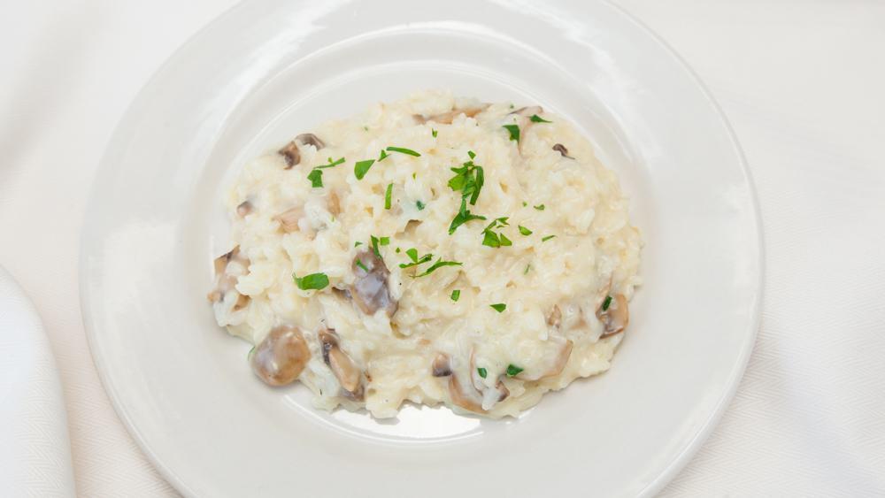 Funghi Risotto · With wild mushrooms and a vegetable stock base.