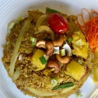 Pineapple Fried Rice/Lunch · Stir-fried jasmine rice with pineapple, egg, onion, carrot, tomato, and cashew nuts flavored...