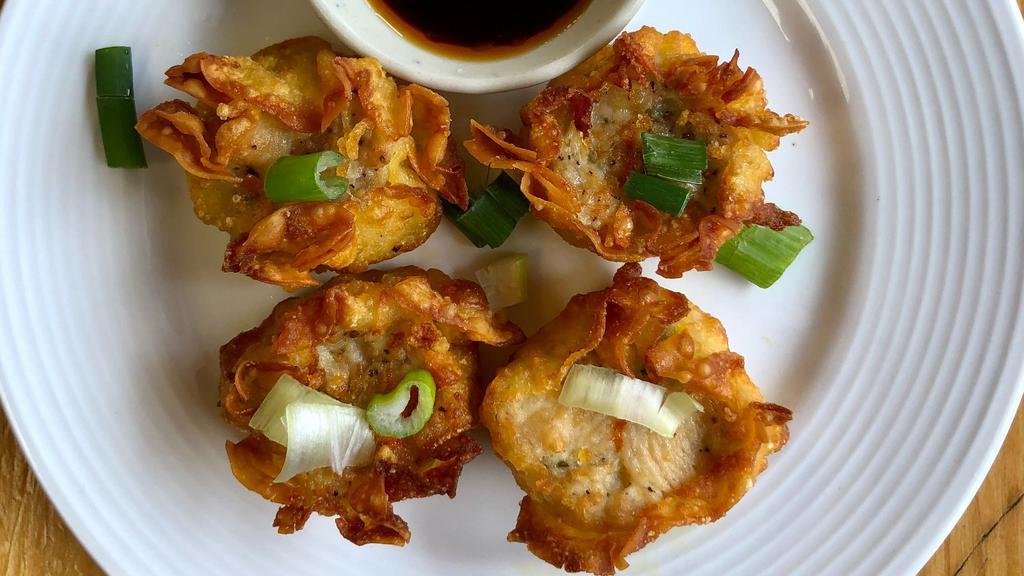 Thai Dumpling (6 Pieces) · Steamed or fried grounded chicken wrapped in wonton skin, steamed dumpling served with soy vinaigrette sauce and topped with fried garlic oil, fried dumplings served with sweet chili sauce.