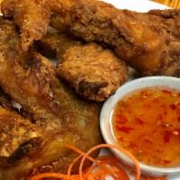Chicken Wing · Thai style crispy deep fried flavorful chicken wings served with sweet chili sauce.