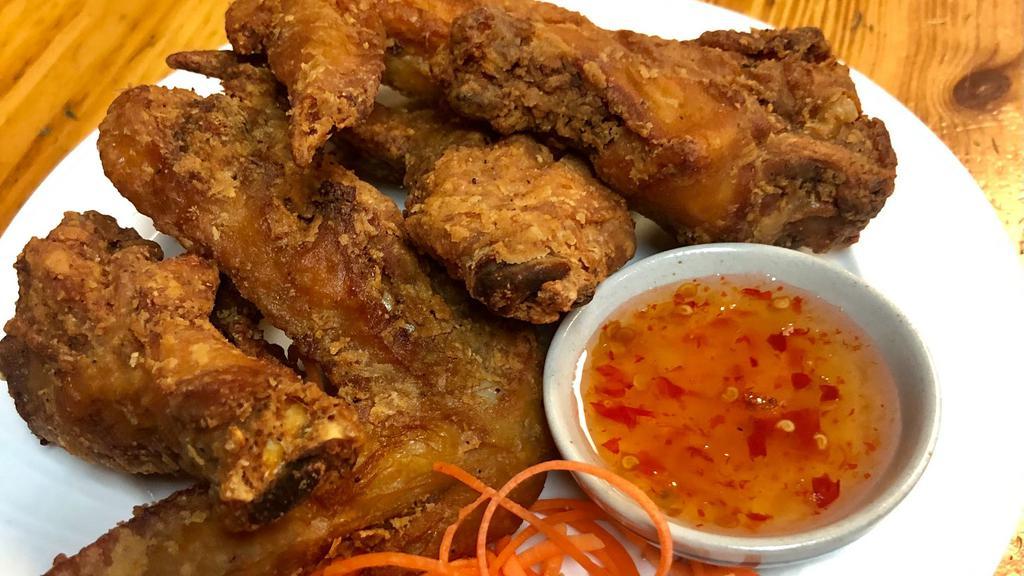 Chicken Wing · Thai style crispy deep fried flavorful chicken wings served with sweet chili sauce.
