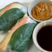 Summer Roll Tofu (2 Rolls) · Fresh vegetables (mixed green salad, carrot, basil leaves, and cucumber) wrapped in a soft r...