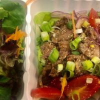 Beef Salad (Nam Tok) · Grilled marinated beef, roasted ground rice, red onion, scallion, tomatoes, lettuce and chil...