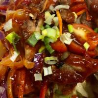 Crispy Duck Salad · Crispy duck, pineapple, red onion, bell pepper, tomato, lettuce, cashew nuts, and chili past...