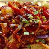 Fried Calamari Salad · Crispy fried calamari, pineapple, red onion, scallion, tomato, lettuce, cashew nuts, and chi...