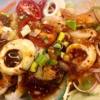 Seafood Salad · Steamed mixed seafood, lemongrass, red onion, tomato, lettuce, scallion, and chili paste wit...