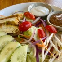Thai Salad · Fresh vegetables (lettuce, cucumber, tomato, red onion, bean sprout, and carrot) and tofu se...