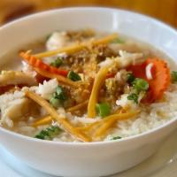Ginger Rice Soup (Large 32 Oz) · Clear soup with Jasmine rice and fresh ginger topped with fried garlic and scallion.