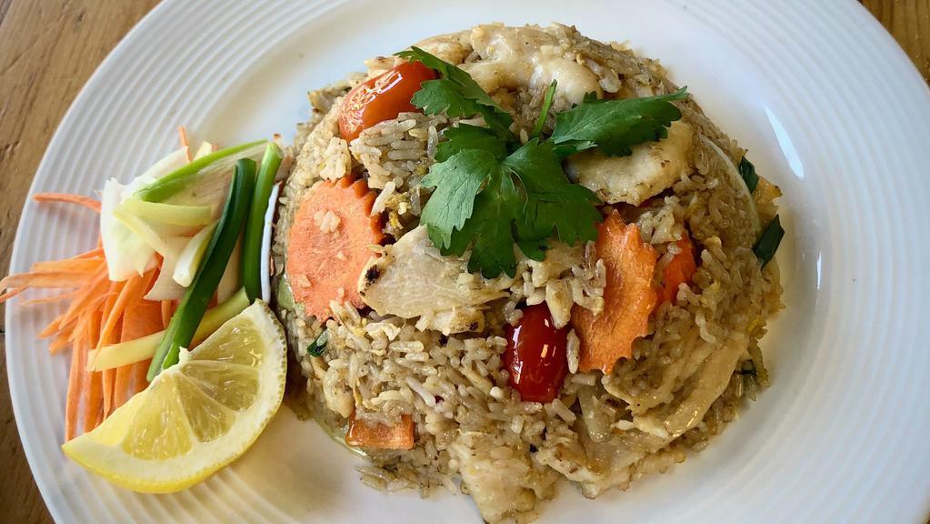 Thai Fried Rice · Stir-fried jasmine rice with egg, carrot, onion, tomato, and scallion flavored with a variety of sauces.