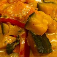 Pumpkin Curry · Red curry paste, coconut milk, pumpkin, carrot, bell pepper, and fresh basil.