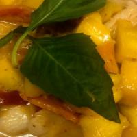 Mango Curry · Red curry paste, coconut milk, mango, bell pepper, carrot, and fresh basil.