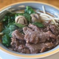 Beef Noodle Soup · Broth soup with thin rice noodles, sliced beef, meat balls, bean spout, Chinese broccoli, an...