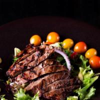 Skirt  Steak Salad · Cumin-Coriander Skirt Steak, Roasted Wild Mushrooms & Green Spring Mix