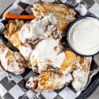 Blanco Tequila Wings · Flambé' with tequila and tossed in our homemade white BBQ sauce, served with homemade ranch.