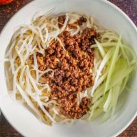 Noodles With Ground Pork & Bean Paste Sauce (Zha Jiang Mian) / 炸醬麵 · Noodles with a savory ground pork and bean paste sauce, served with shredded cucumbers and b...