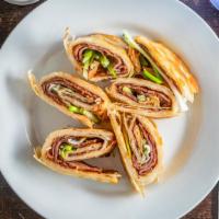 Rolled Pancake With Sliced Beef / 大餅捲牛肉 · Rolled pancake with , scallion, sliced beef, and sauce.