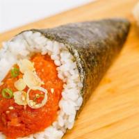 Spicy Tuna Hand Roll · Raw spicy tuna, sesame seeds, and scallions.