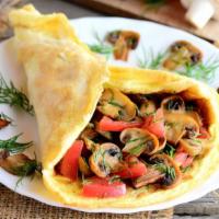 Loaded Veggie Omelette · Delicious Breakfast omelette made using 3 eggs, onion, tomato, mushroom, green and red peppe...