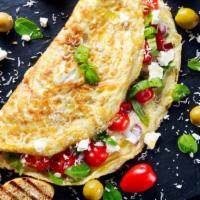 Greek Omelette · Delicious Breakfast omelette made using 3 eggs, spinach, tomato, and feta cheese. Served wit...