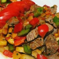 Lamb Adana · Hand chopped lamb with red bell peppers seasoned with unique herbs. Served with lavash and o...