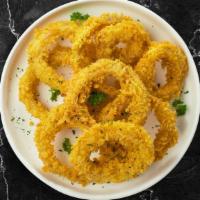 Ring Crispies · Sweet onions fried until golden- garnished with sea salt and spices.