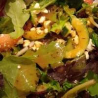 Greek Salad · Mix Greens, Tomato, Onions, Feta Cheese Kalamata Olives, Stuffed Grape Leaves , Cucumber.