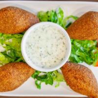 Kibbeh · 4 pieces. Fried ovals of ground beef & cracked wheat stuff.