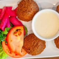 Falafel · 4 pieces. Fried ground chick peas & herbs.