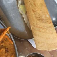 Butter Masala Dosa · Thin crepe roasted with butter and filled with mashed potatoes, onions, green peas and cashe...