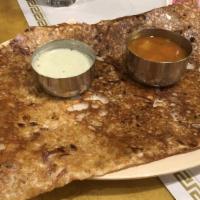 Onion Dosa · Vegan. Crepe filled with onions. Served with sambar and chutney.