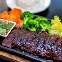 Skirt Steak · With thai spicy sauce and steam vegetable. Served with salad and jasmine rice.