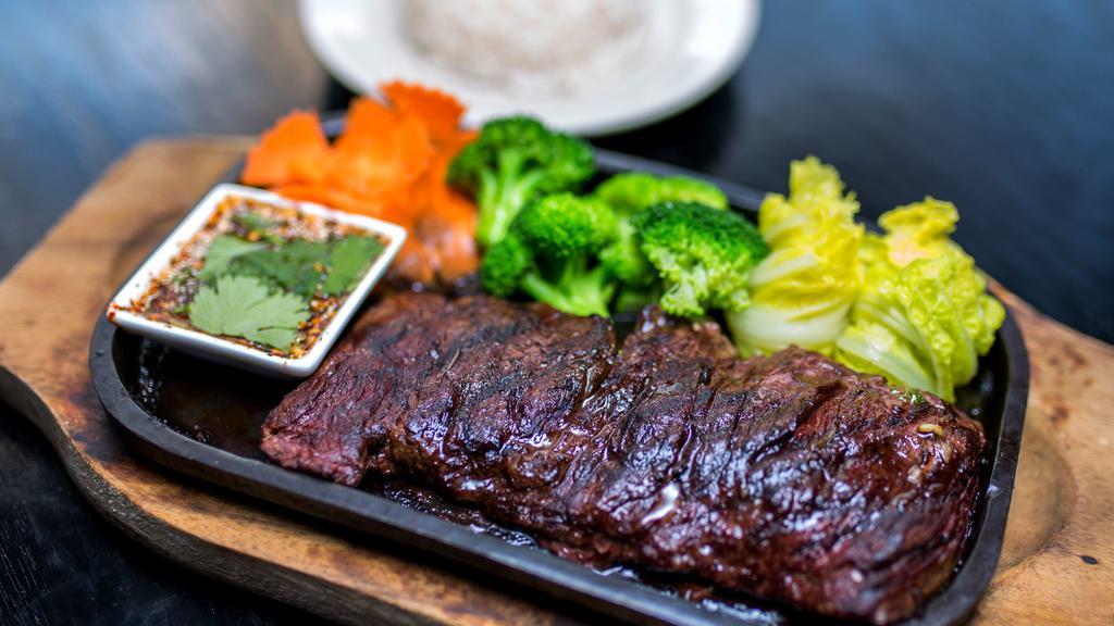 Skirt Steak · With thai spicy sauce and steam vegetable. Served with salad and jasmine rice.