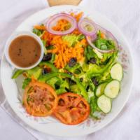Garden Salad · Romaine, tomato, carrots, onions, peppers, cucumber, black olives and choice of dressing.