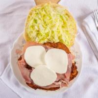 Mg Sandwich · Chicken cutlet, prosciutto, lettuce, fresh mozzarella and garlic mayo on wedge.