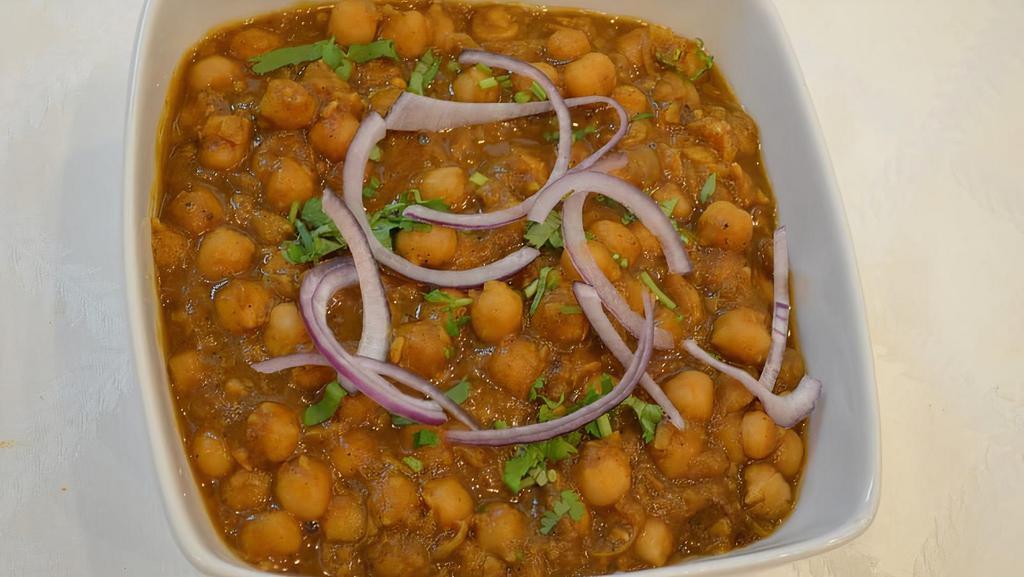 Channa Masala · Vegan. Gluten-Free. Chickpeas cooked with traditional homemade spices.