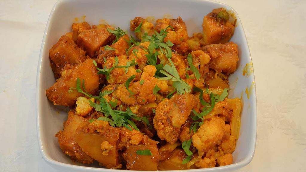 Alu Gobi Matar · Vegan. Gluten-Free. Potatoes, cauliflower, and green peas seasoned with masala.