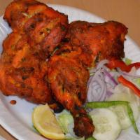 Tandoori Chicken · Gluten-Free. Grilled tender half-chicken deliciously marinated in yogurt and mild spices.